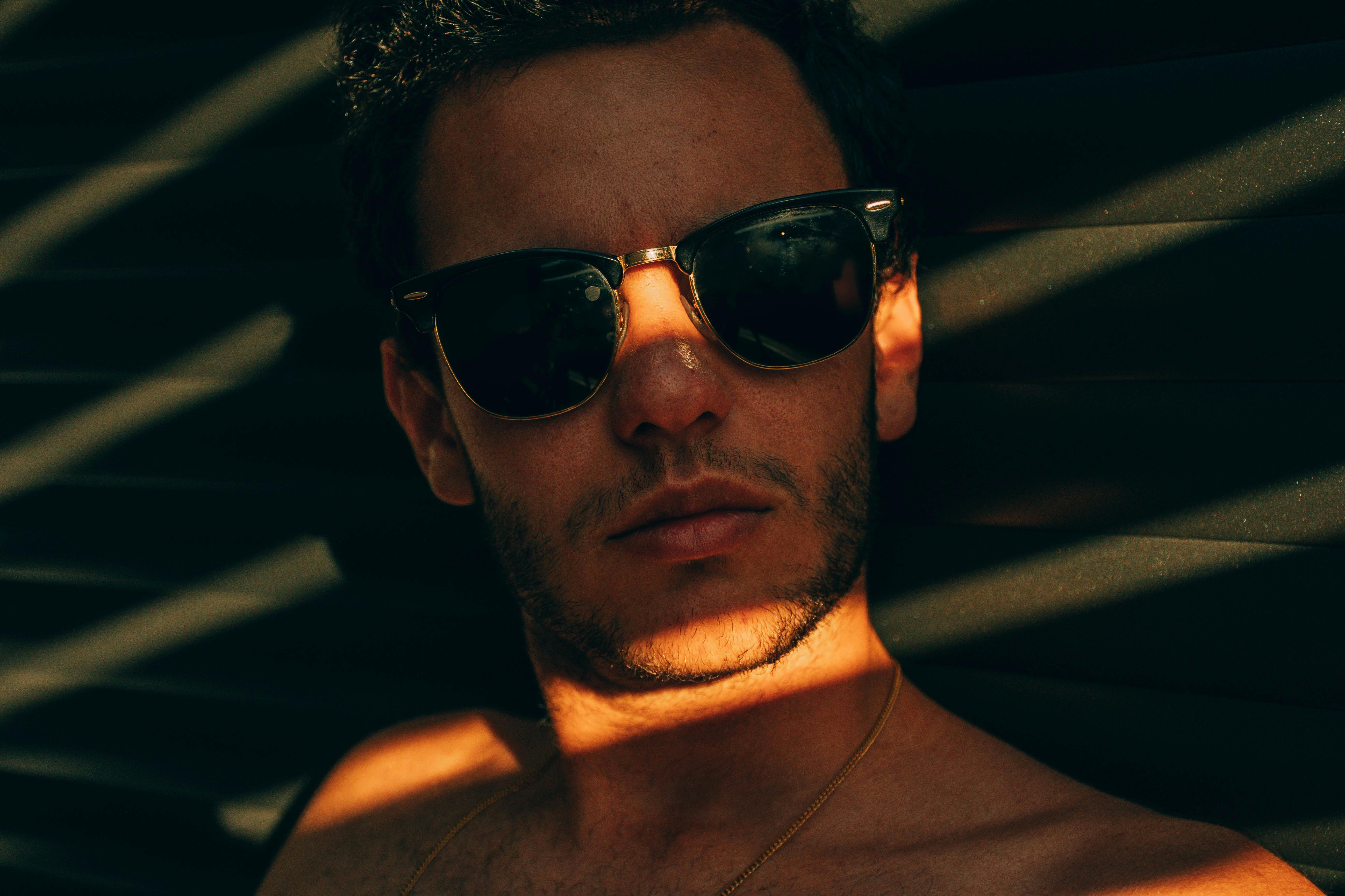 Person wearing browline sunglasses, portrait-style