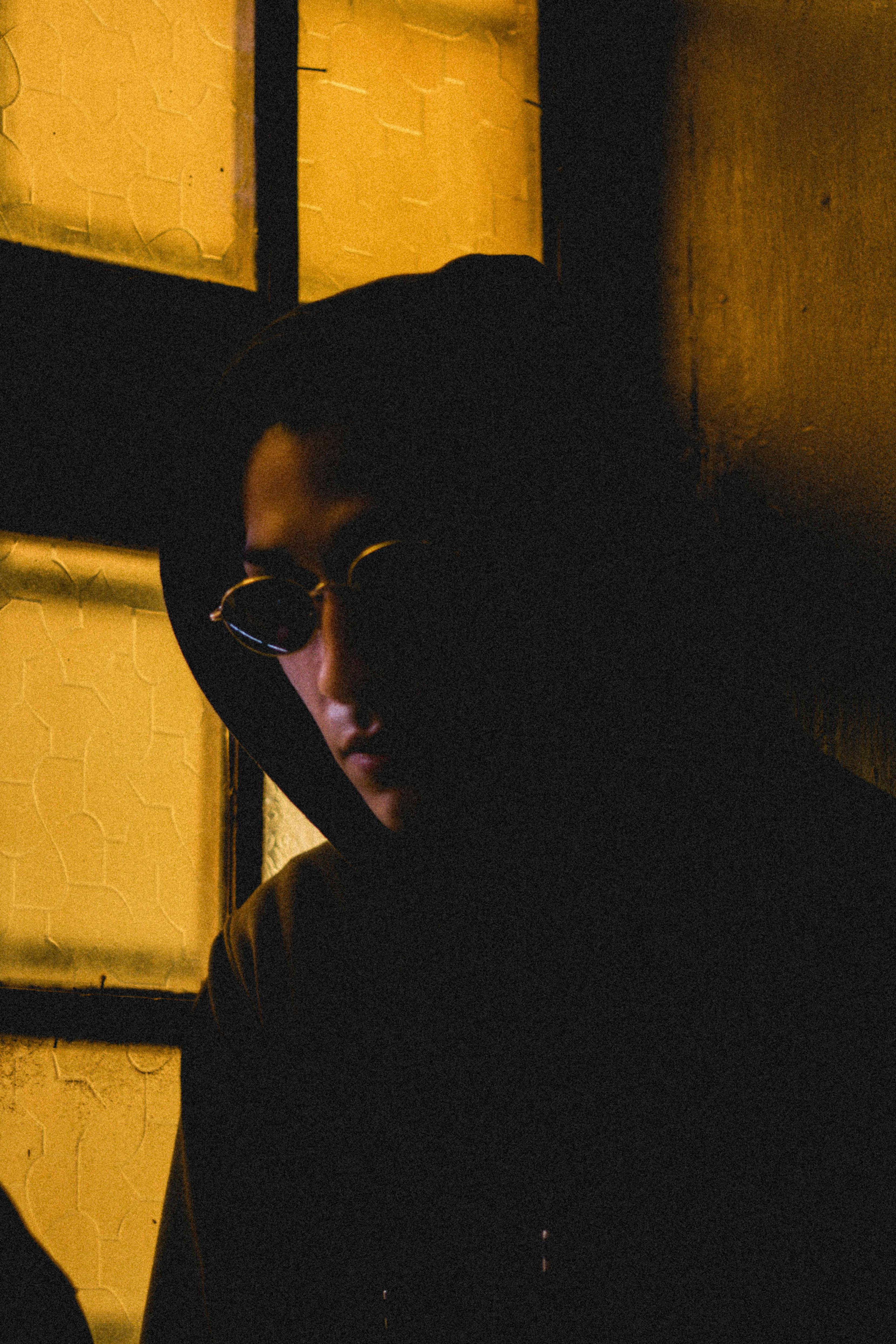 Sunglasses on a windowsill with spring light casting soft shadows